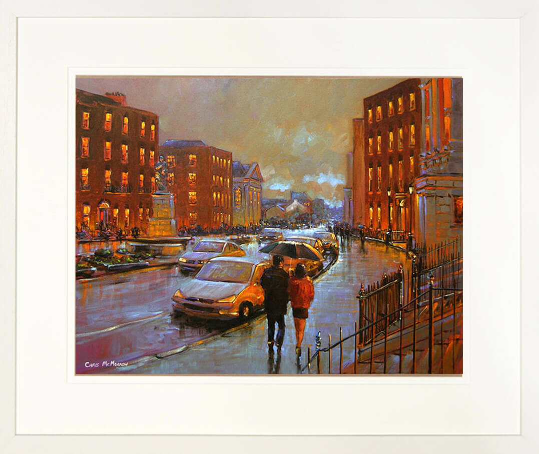 A framed print of a painting of the Crescent street and traffic island in Limerick city