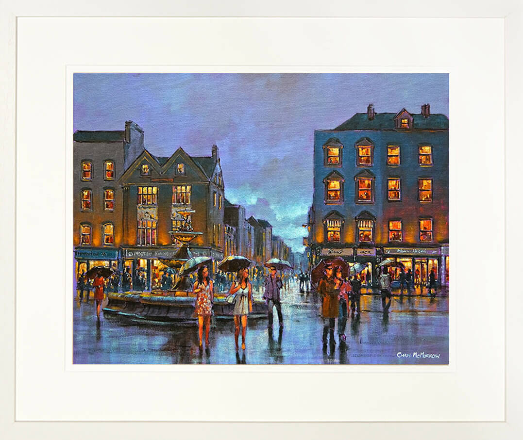 A framed print of a painting of an a crowded evening on Grand Parade, Cork city centre