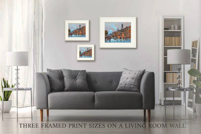 PHOTO OF THE THREE framed PRINT SIZES ON A LIVING ROOM WALL