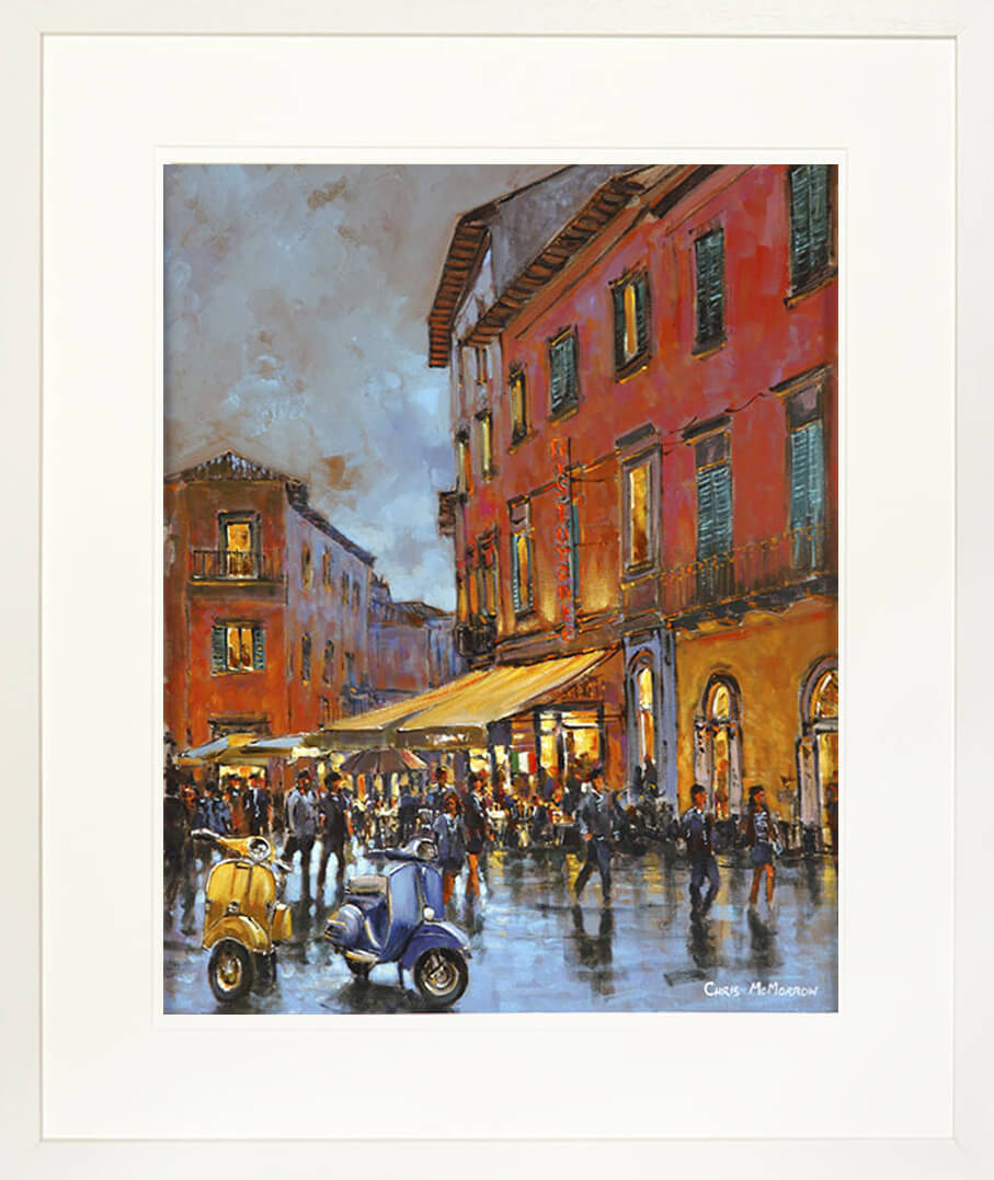 A framed print of a colourful painting of two Vespa scooters in the Italian city of Pisa
