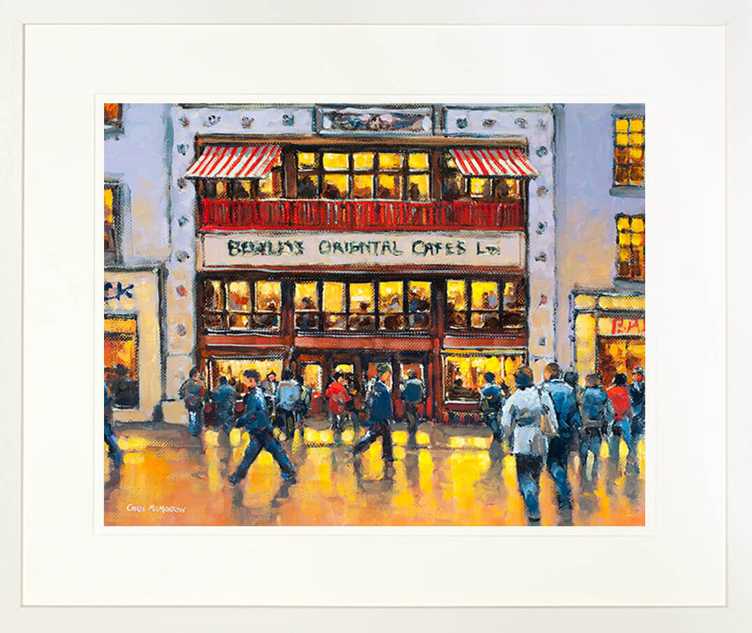 A framed print of a painting of people walking by Bewleys iconic café on Grafton Street, Dublin