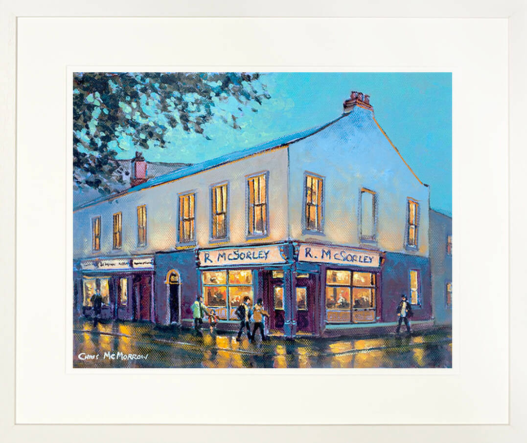 A framed print of a painting of McSorleys Pub on the corner of the main street through Ranelagh village in Dublin