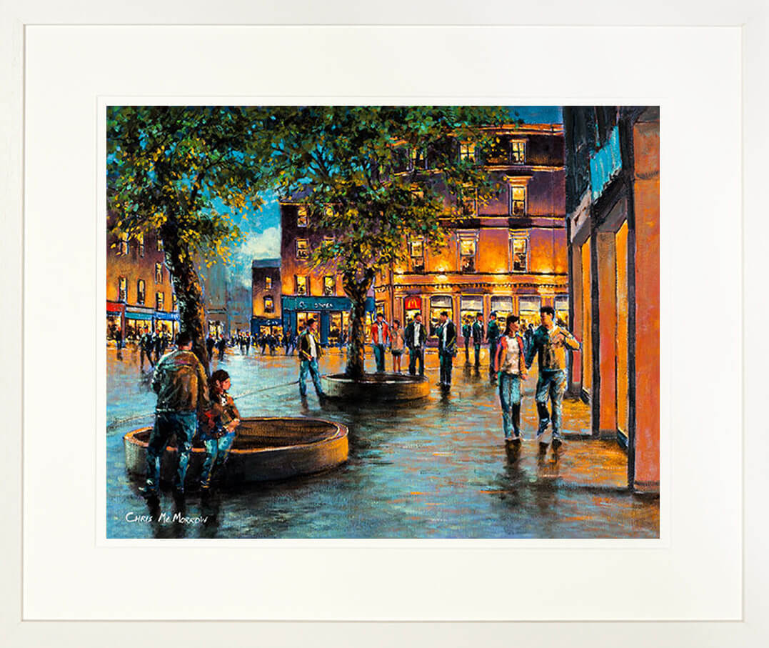 A framed print of a painting of people out and about on Grand Parade in Cork City centre