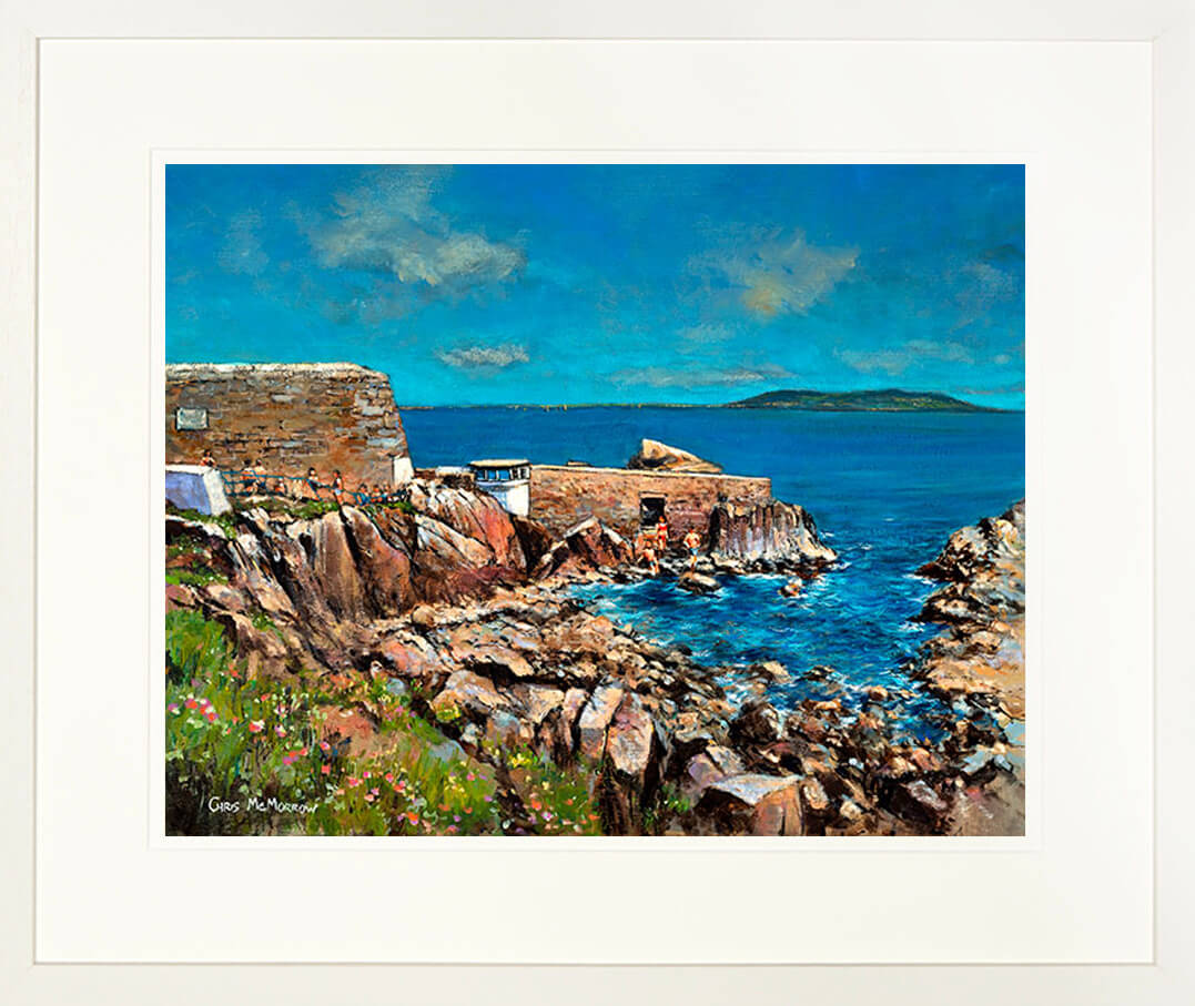 A framed print of a painting of the Forty Foot by the Martello Tower in Sandycove, County Dublin