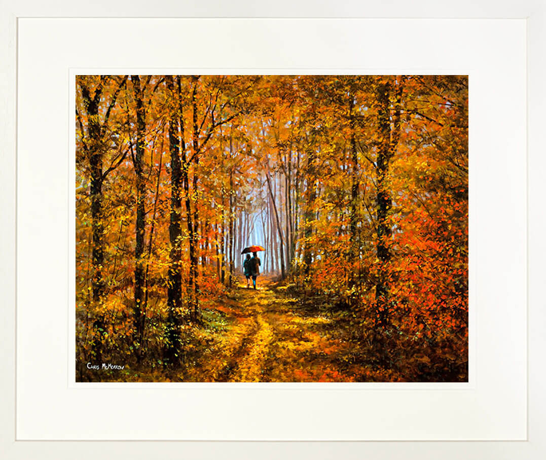 A limited edition print of a romantic painting called Forever Autumn showing a couple walking in a forest mounted in a cream frame