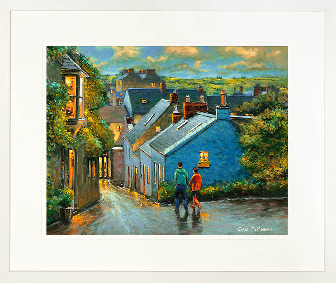 A framed print of a painting of a couple taking an evening stroll in Kinsale town, Co Cork