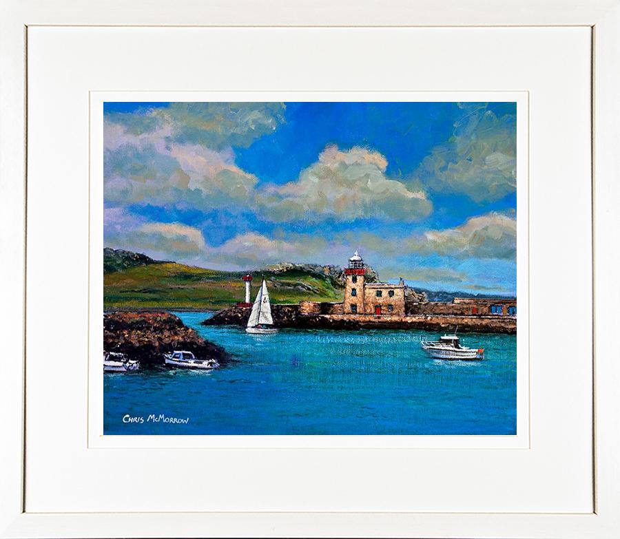 A framed print of a painting of Howth Harbour, boats and the Lighthouse