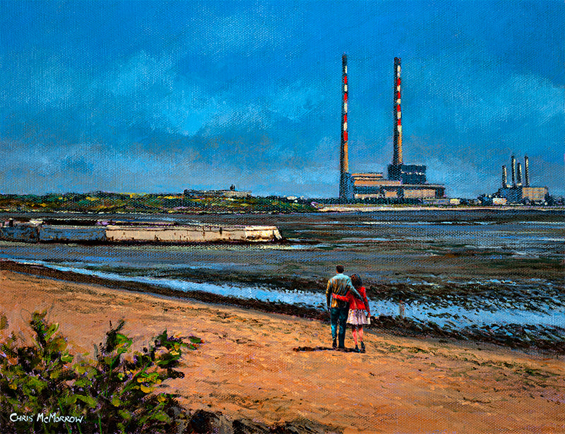 A couple take a leisurely stroll along the beach at Sandymount