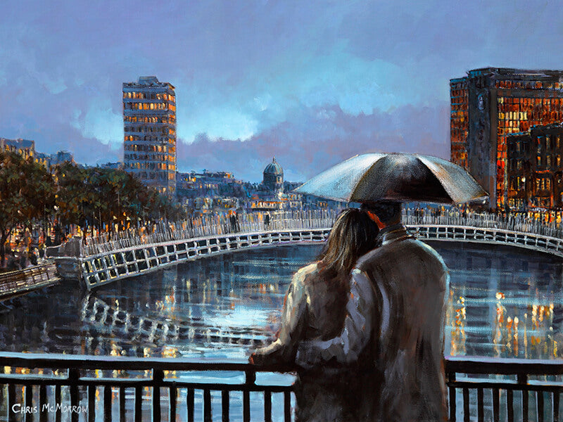 couple under umbrella looking out at liffey river
