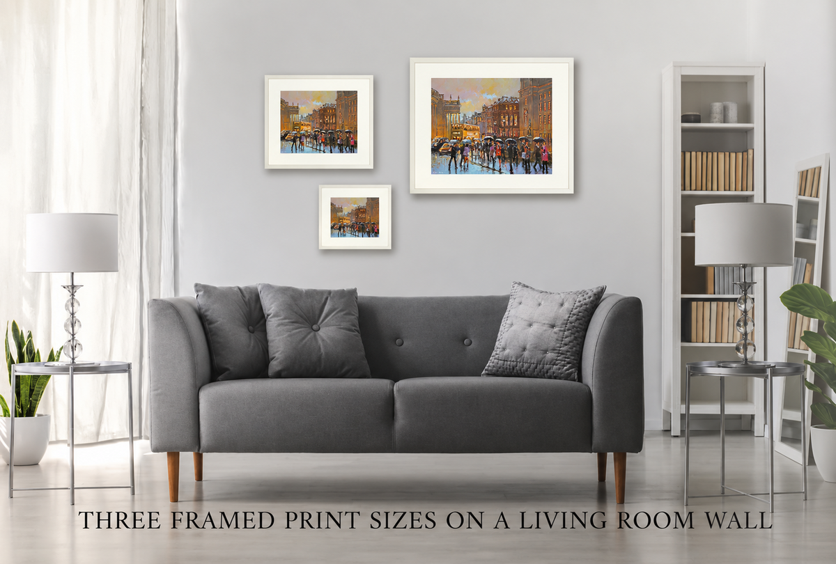 Three framed print sizes of College Green in the Rain, Dublin on a living room wall