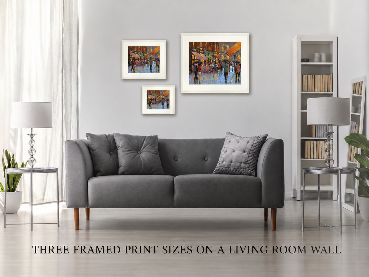 Three framed print sizes of Castlemarket Glow, Dublin on a living room wall