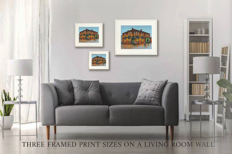Three pub prints on a living room wall