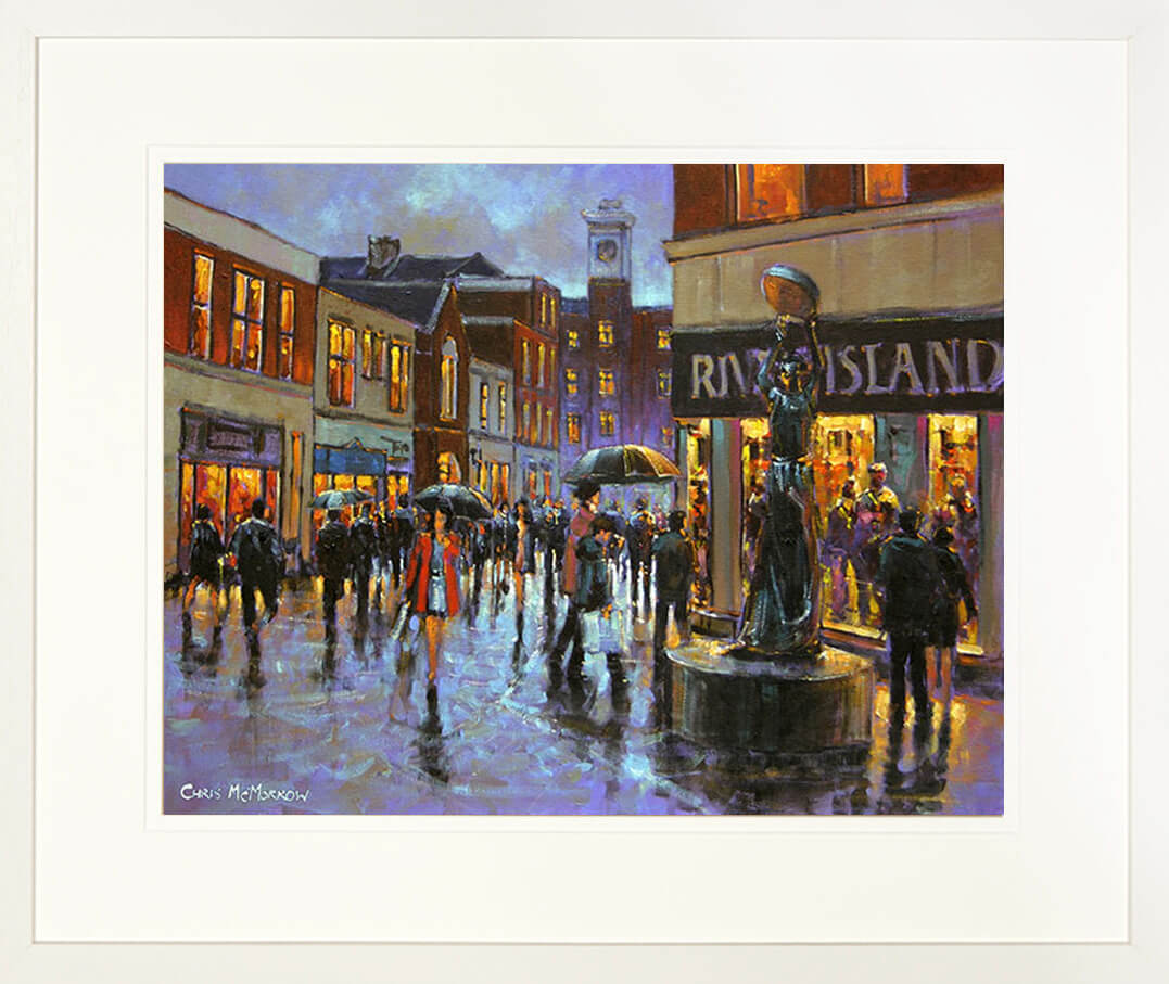 A framed print of a painting of a crowd of people on a busy Limerick shopping street