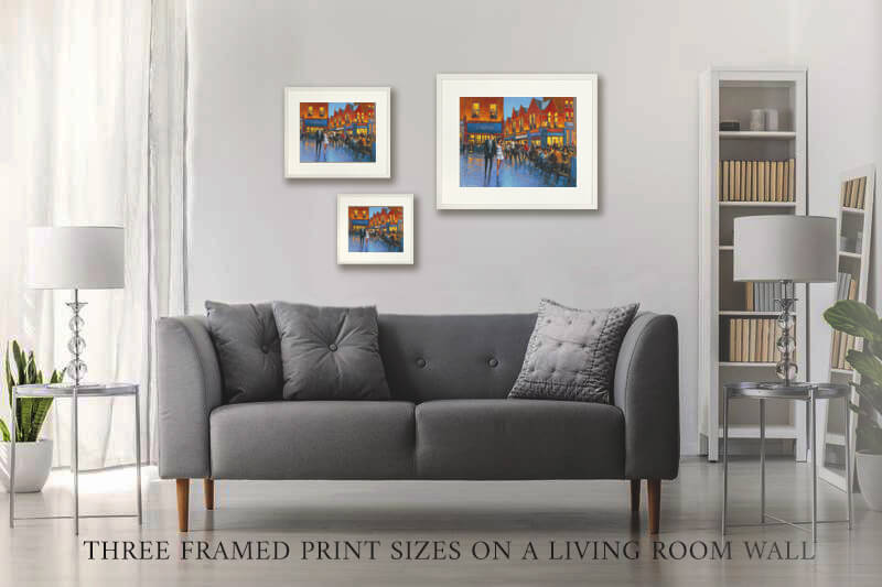 Photo of three versions of framed prints on a living room wall