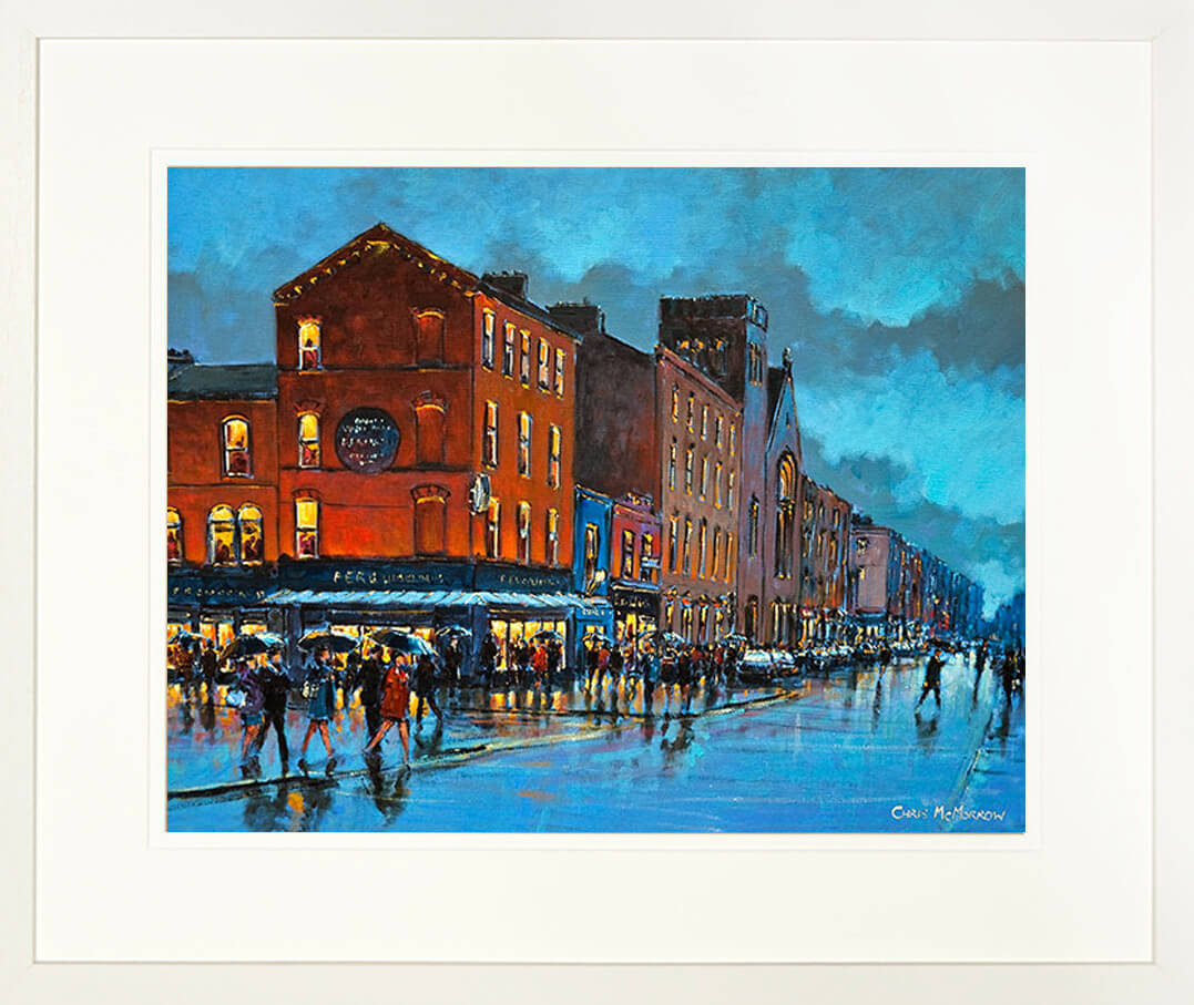 A framed print of a painting of a crowded Limerick city centre