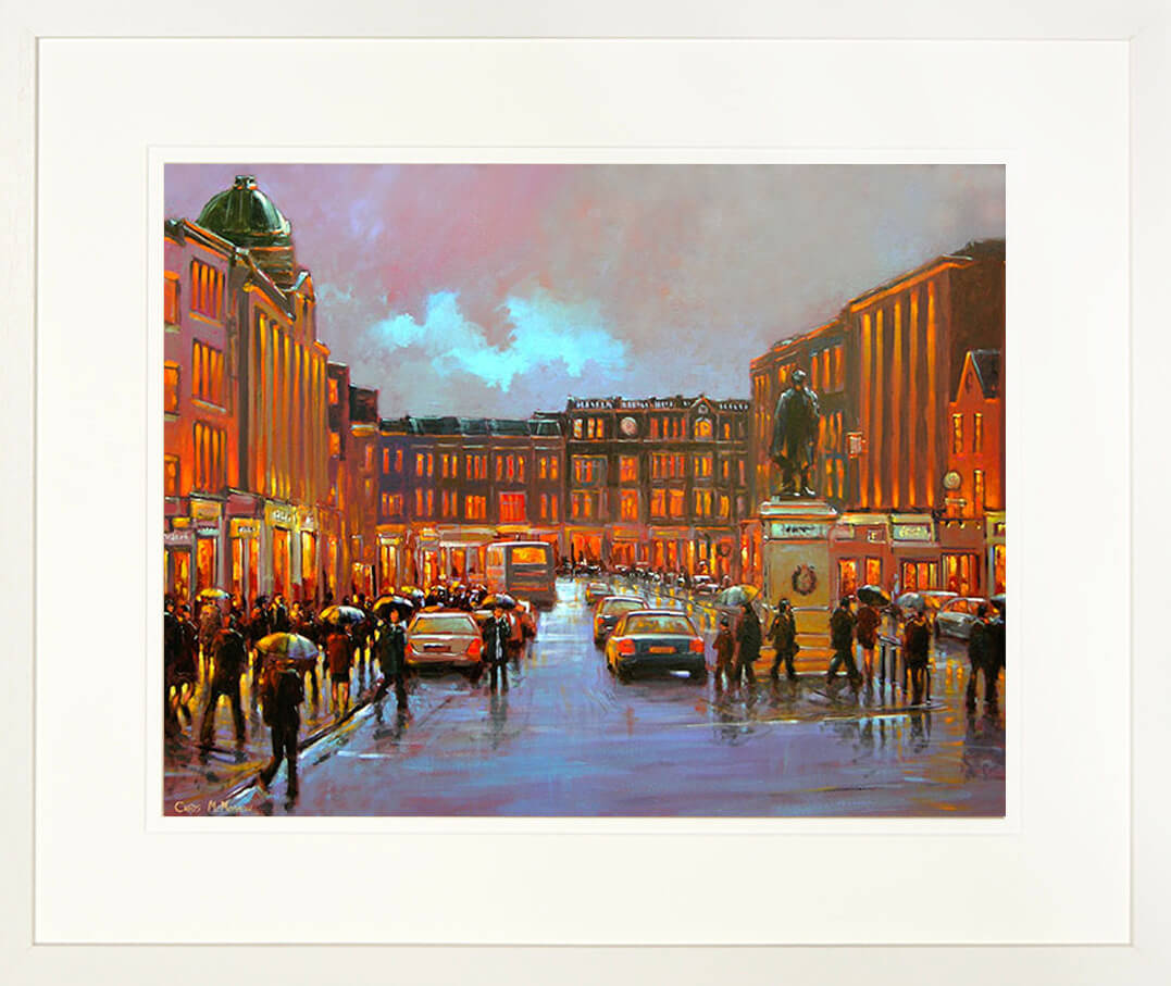 A framed print of a painting of PAtrick Street , Cork