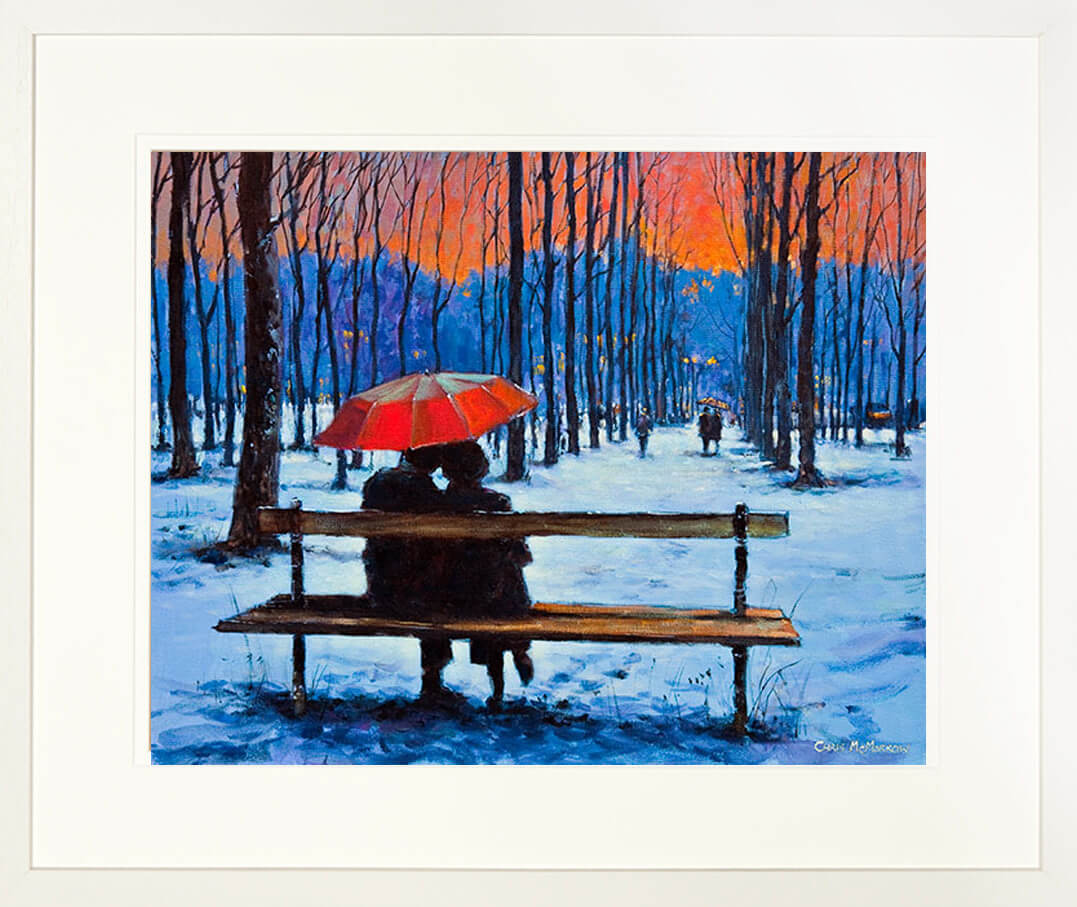 framed print of a couple under an umbrella in a snowy park