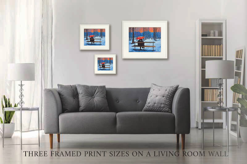PHOTO OF THE THREE framed PRINT SIZES ON A LIVING ROOM WALL