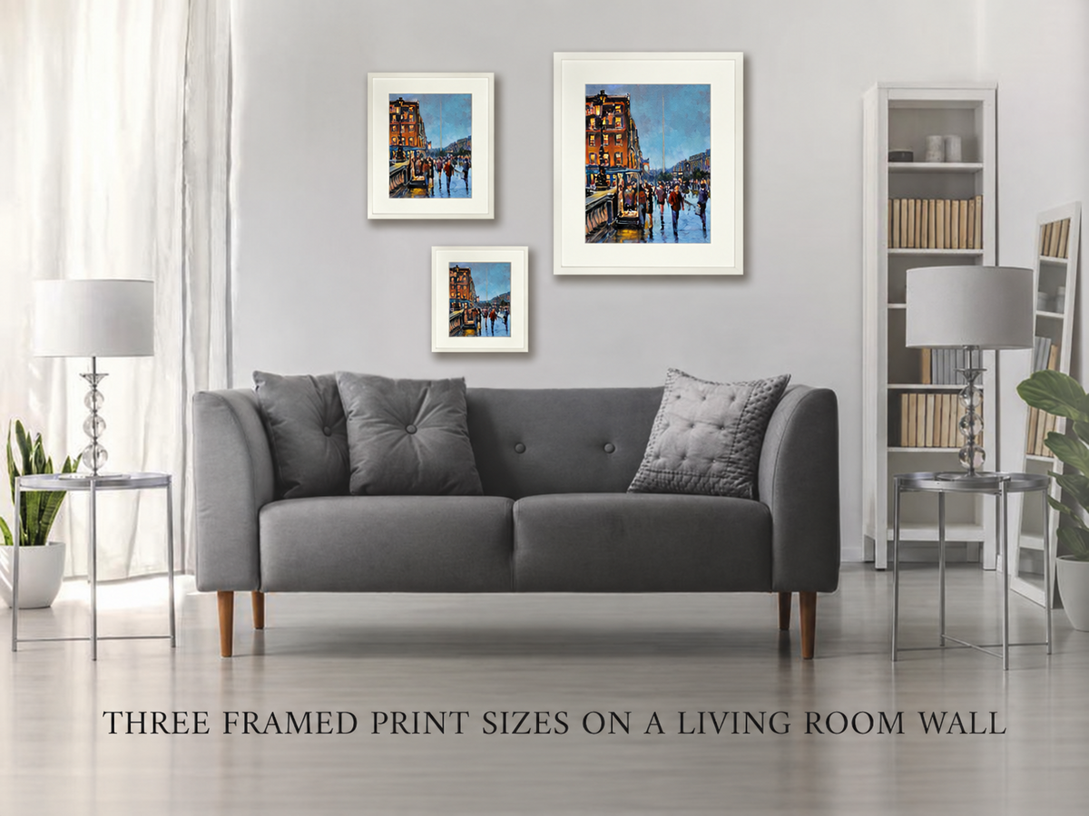Three framed print sizes of O'Connell Bridge in the Rain, Dublin on a living room wall