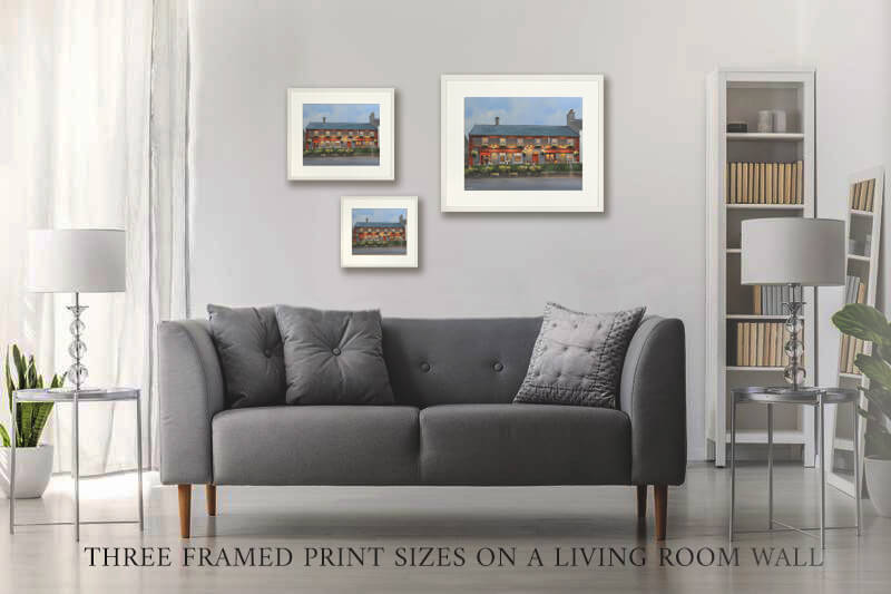 Three framed prints of Gibneys Pub on a living room wall