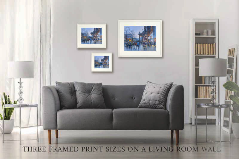 three framed prints of oconnell street on a living room wall