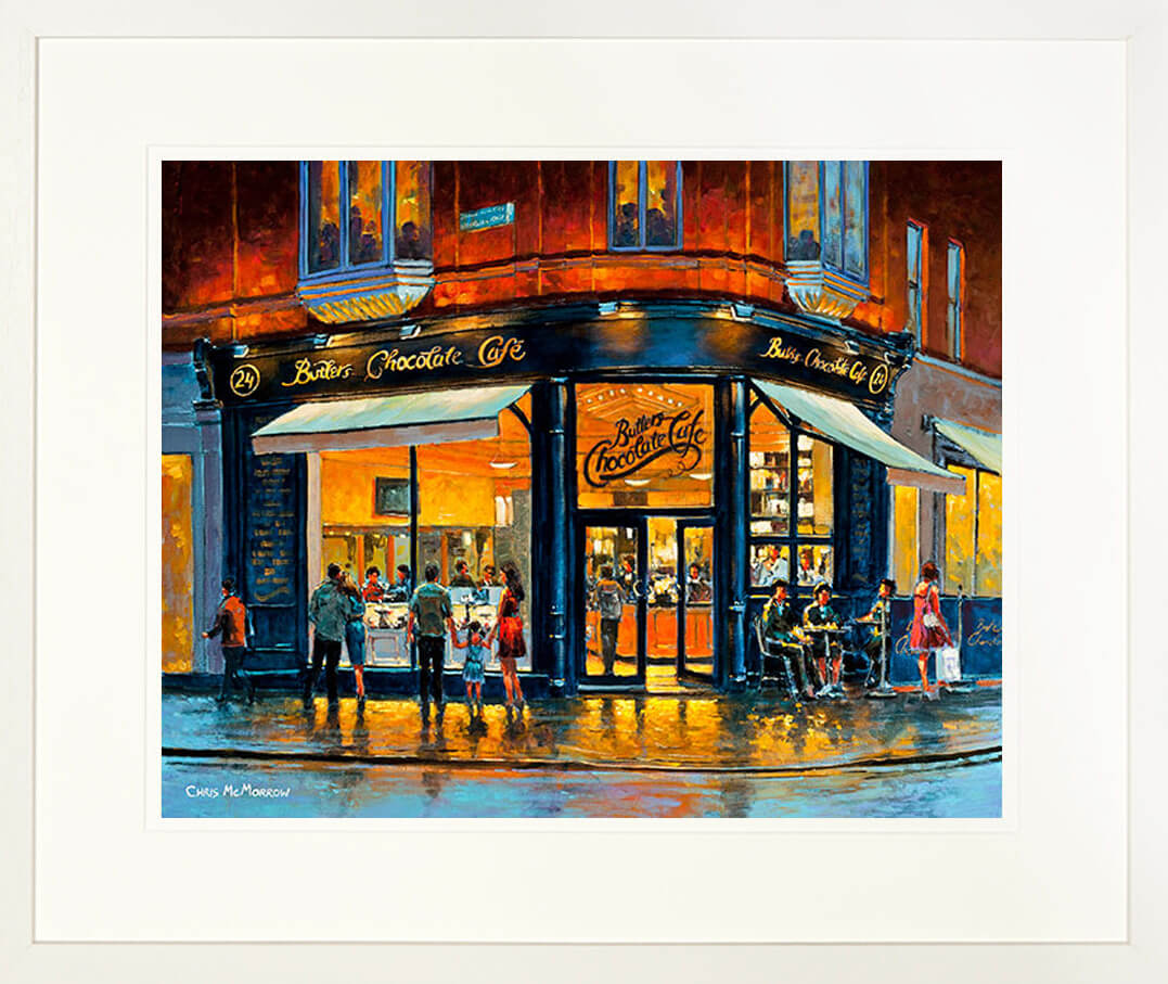 A framed print of a painting of Butlers Café on the corner of South william Street, Dublin