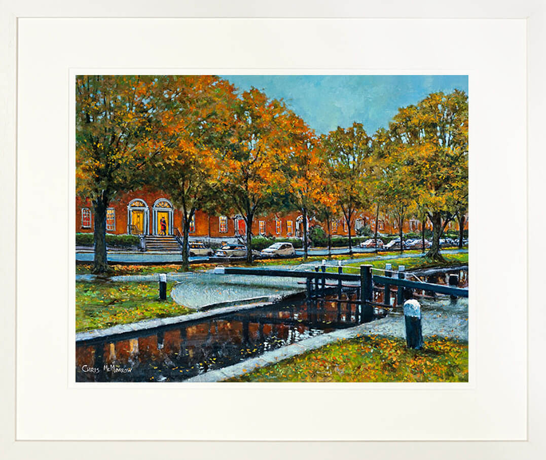 A framed print of a painting of the Grand canal banks in Dublin City centre