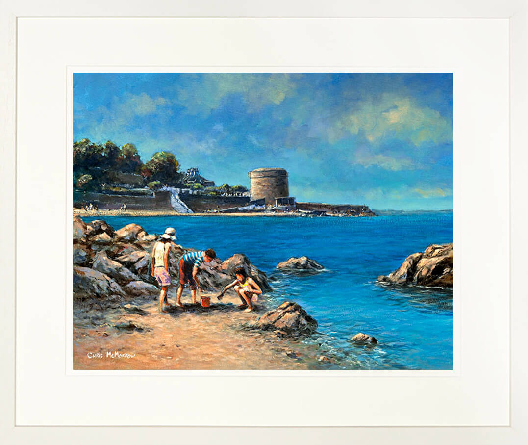 A framed print of a painting showing three children looking for crabs and shells by the ocean edge at Seapoint, County Dublin