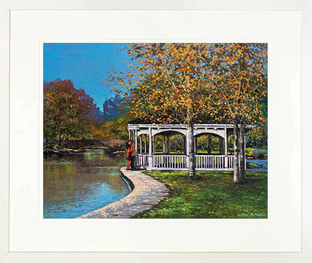 A framed print of a painting of lovers in a romantic embrace by the bandstand in St Stephens Green, Dublin