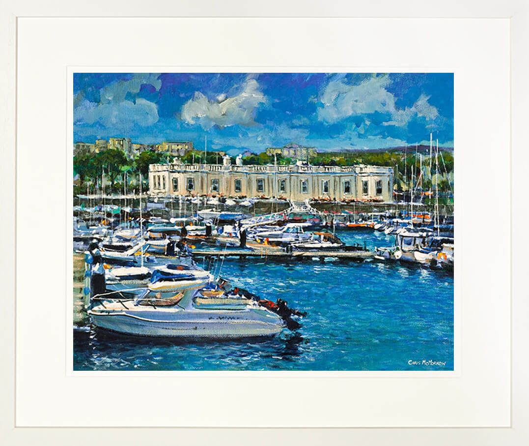 A framed print of a painting of a view of boats moored at the Royal Irish Yacht Club, Dun Laoghaire, Dublin