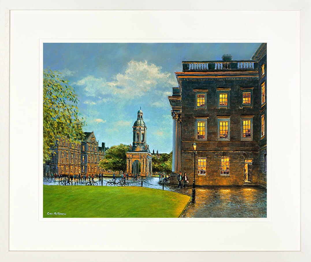 A framed print of a painting showing the Campanile and the inside grounds of Trinity College, Dublin