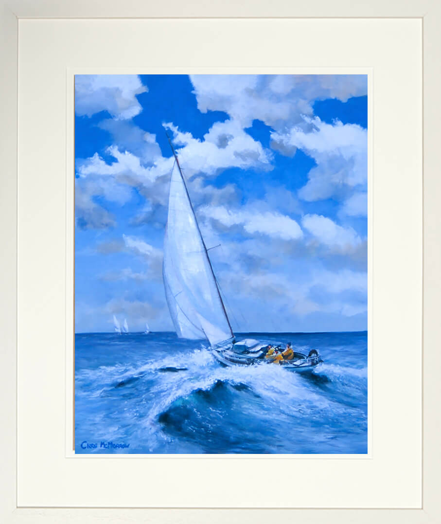 Framed print of a Sailboat on choppy waters with a blue sky and clouds