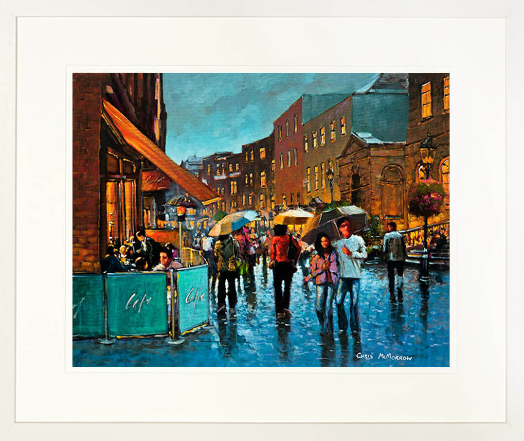 A framed print of a painting of a crowded South William Street, Dublin city centre