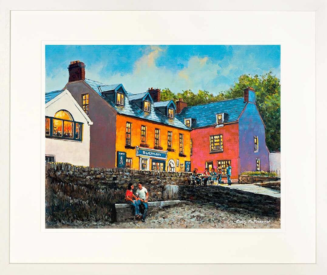 A framed print of a painting of a couple outside the Bulman Bar in Summercove , Kinsale, Co Cork