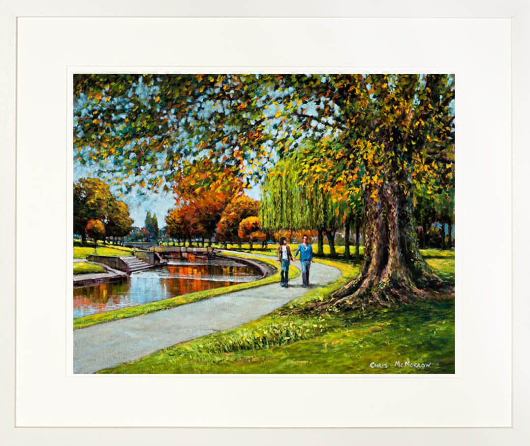 A framed print of a painting of a couple walking in Tolka Park, Drumcondra, Dublin