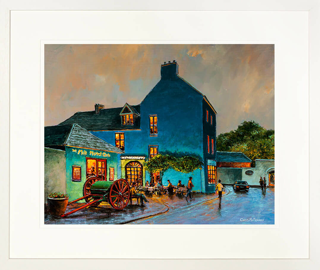 A framed print of a painting named Milk Market View showing a view of Kinsale town, County Cork, Ireland