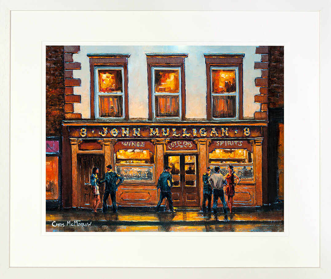 A print of a painting titled Mulligans Pub, Dublin mounted in a cream frame