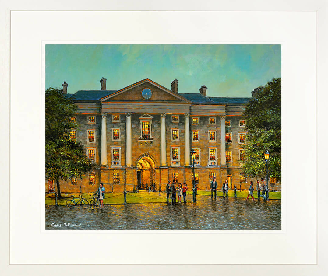 A framed print of the front square of trinity College, Dublin city.