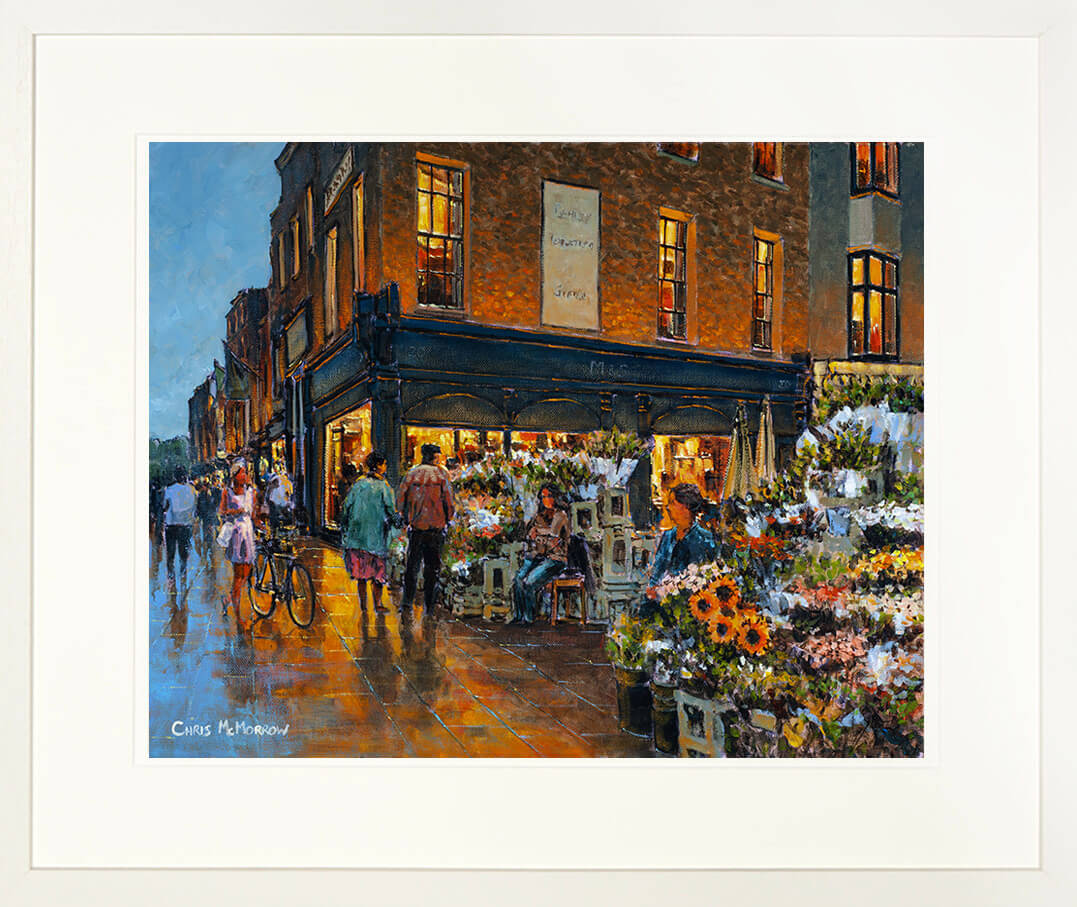 Framed print of a picture of an old couple looking at the flowers for sale at the flower stall on Grafton Street in Dublin city centre