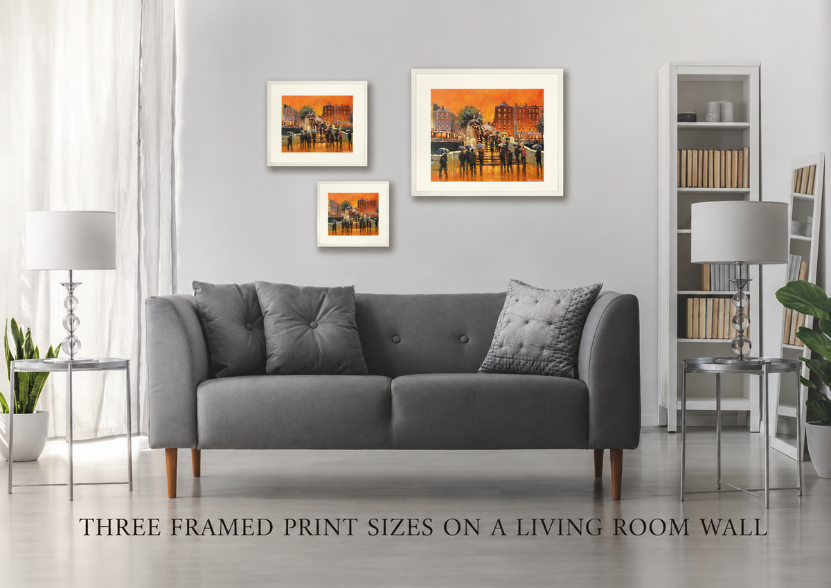 Three framed print sizes of City Glow, Ha'penny Bridge, Dublin on a living room wall