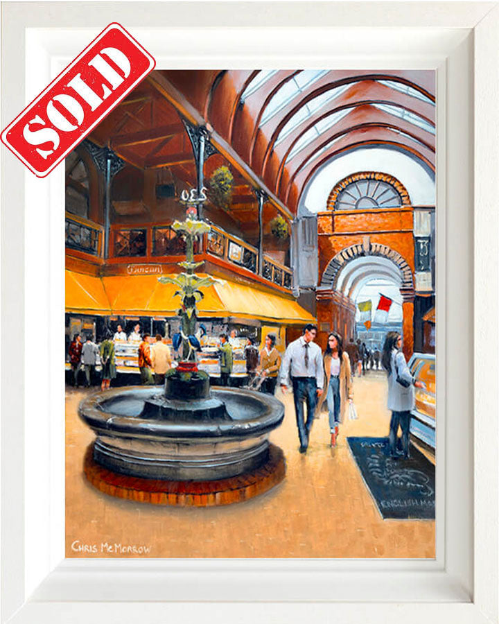 Framed artwork of a bustling indoor market with a fountain and people walking around, labeled 'SOLD'.