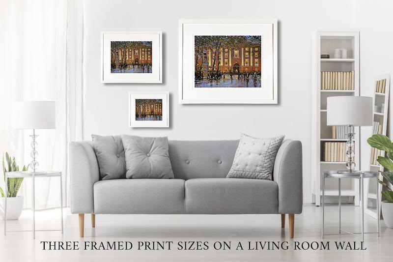 Three framed print sizes on a living room wall
