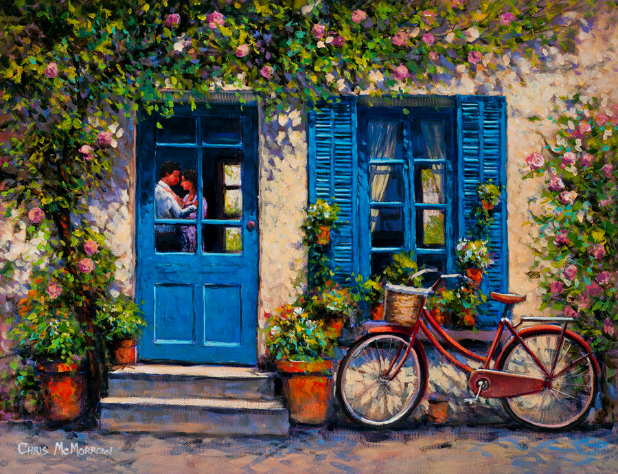 A painting of a house with blue shutters and a couple embracing seen through the window of the door. A red bicycle is parked outside.