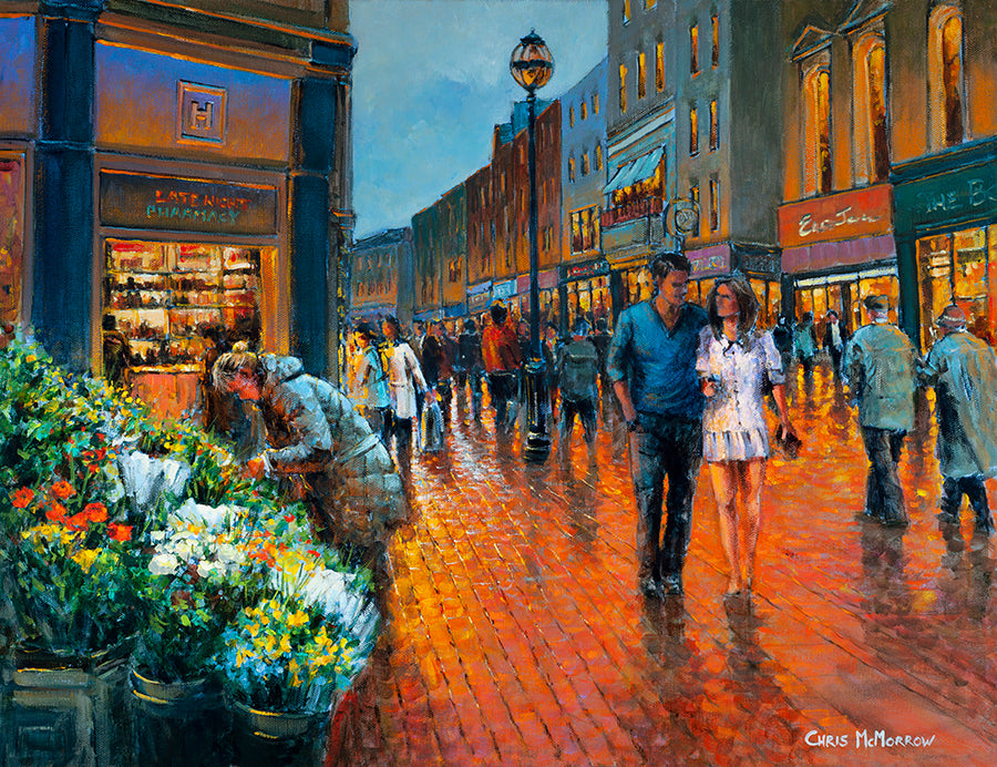 A painting of a young couple walking arm in arm down Grafton Street, Dublin in the evening glow.