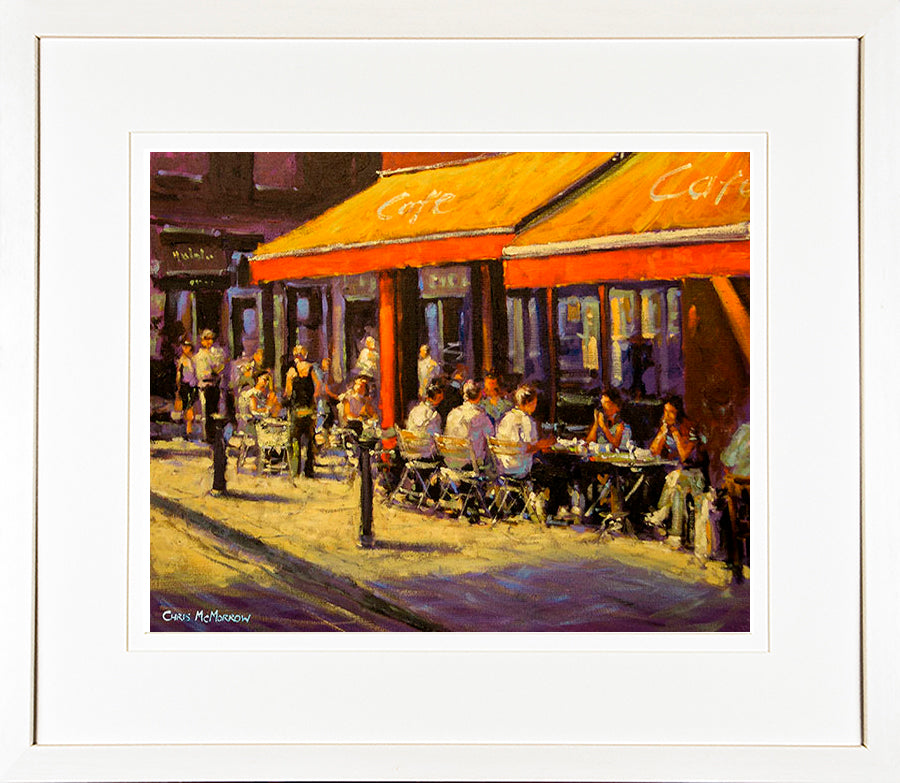 A print in a cream frame of a painting of the Metro Café found on Chatham Street in Dublin city centre